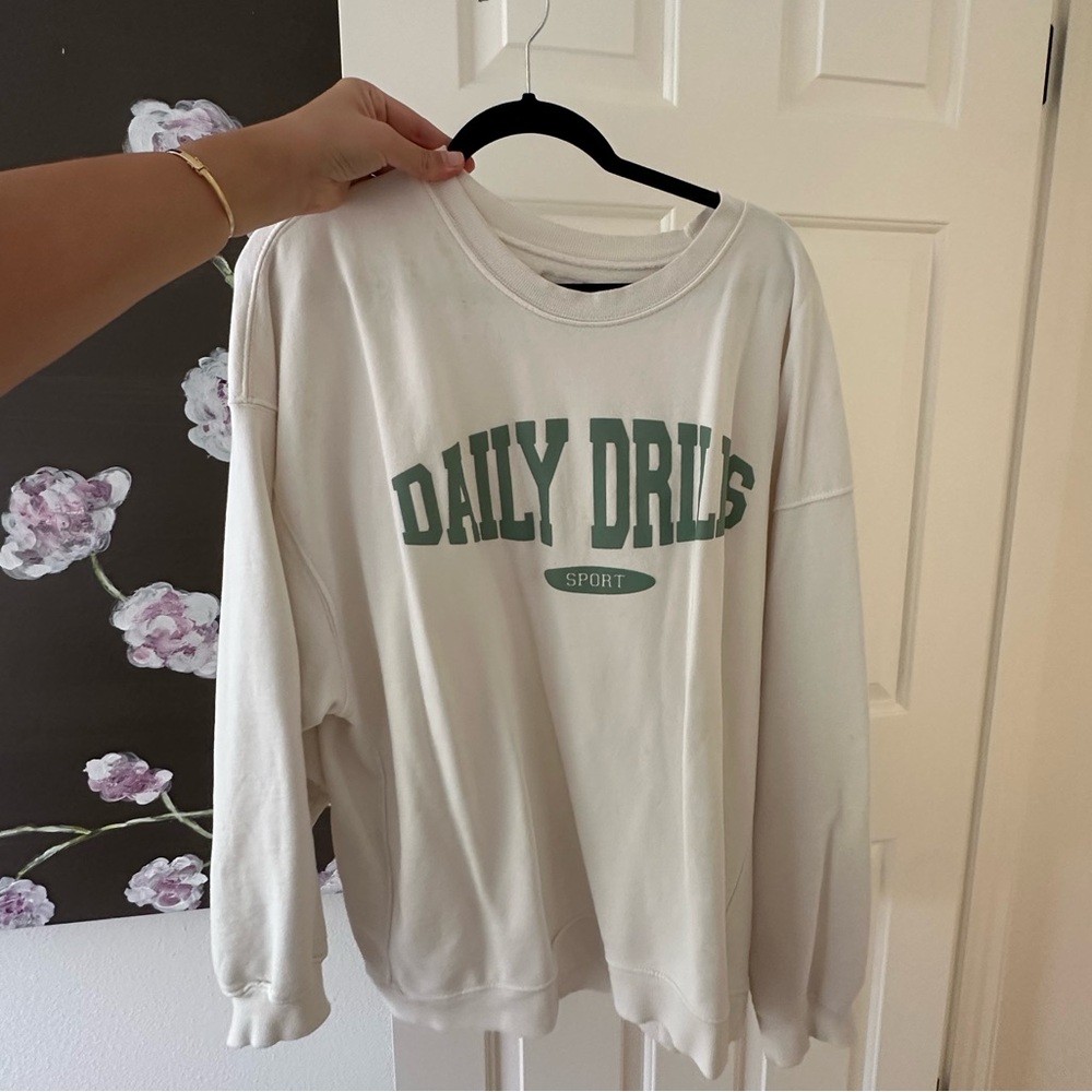 Daily Drills Cream Sweatshirt with Green Logo